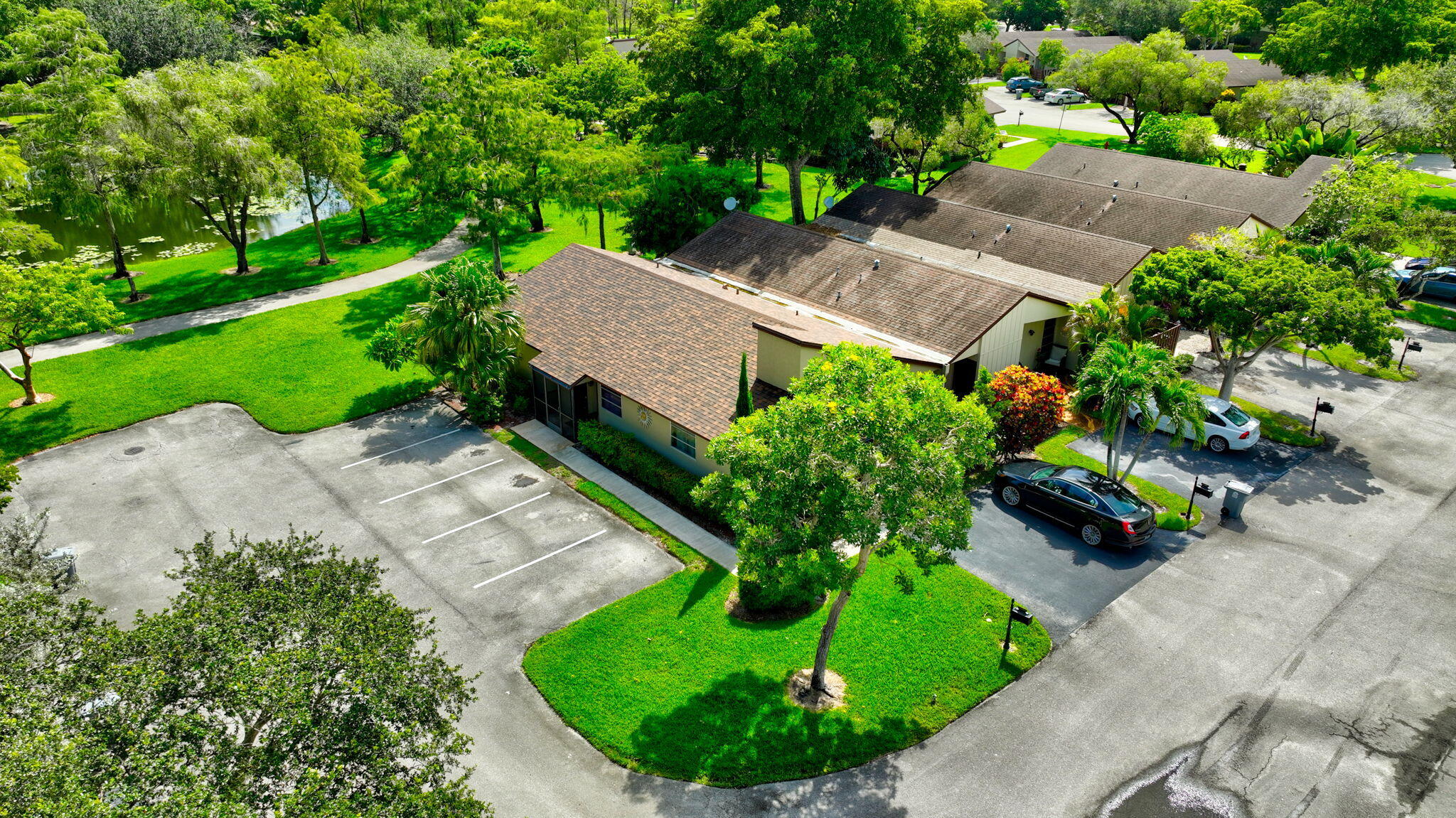 11609 Orange Blossom Lane Boca Raton, FL 33428 - Photo 24 of 30 an aerial view of a house with a garden and trees