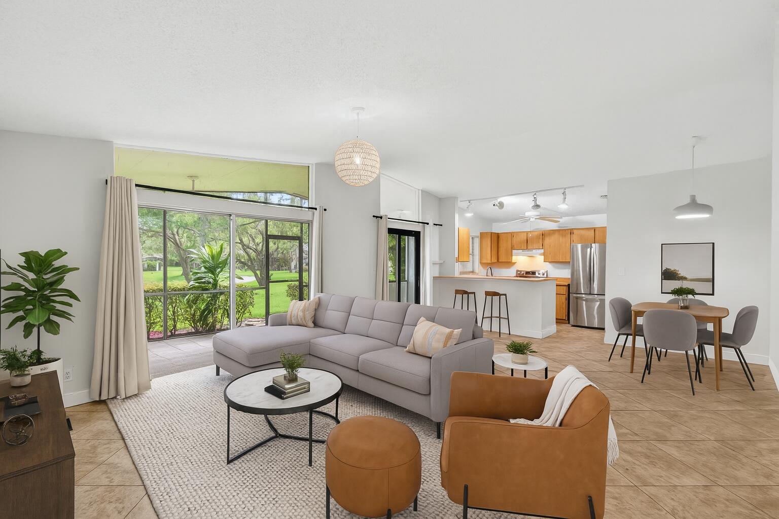 11609 Orange Blossom Lane Boca Raton, FL 33428 - Photo 28 of 30 a living room with furniture and a large window