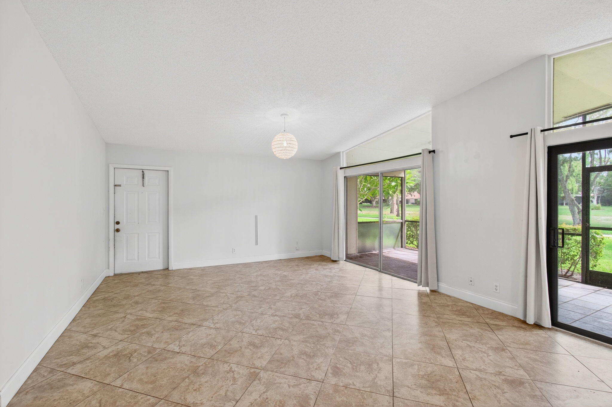 11609 Orange Blossom Lane Boca Raton, FL 33428 - Photo 4 of 30 a view of an empty room with a window