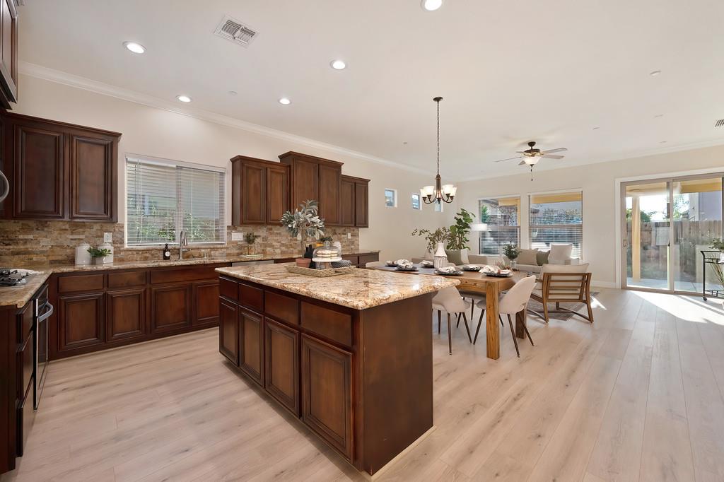 1964 Hartsfield Way Lincoln, CA 95648 - Photo 12 of 37 a kitchen with a sink and wooden cabinets