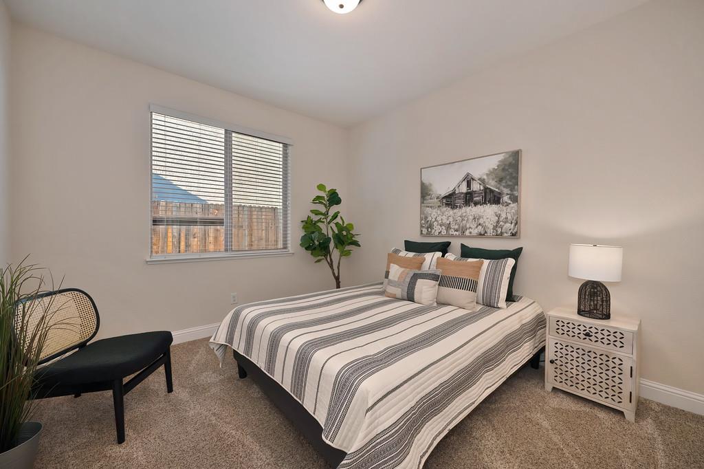 1964 Hartsfield Way Lincoln, CA 95648 - Photo 21 of 37 a bedroom with a bed and a chair