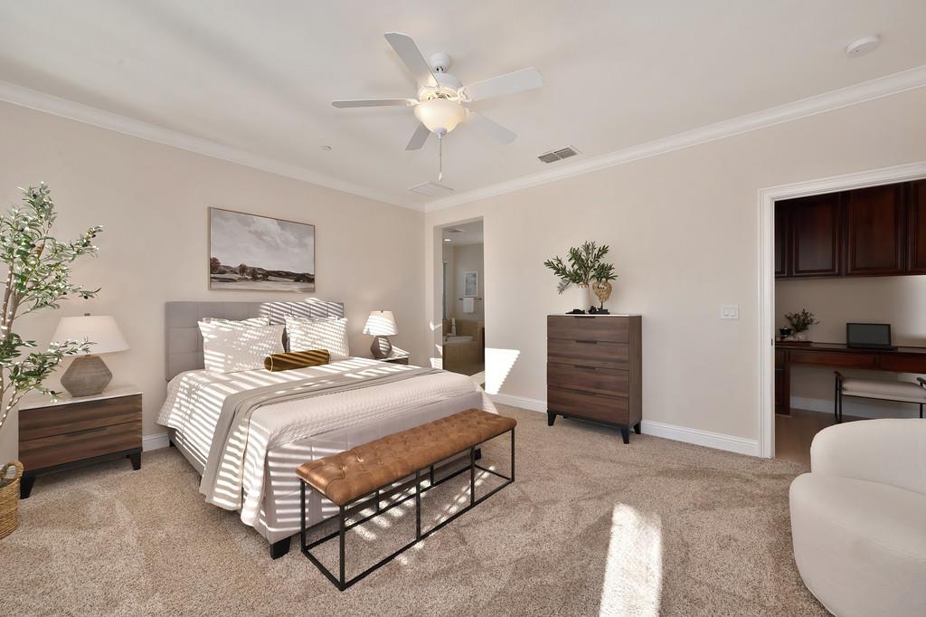 1964 Hartsfield Way Lincoln, CA 95648 - Photo 26 of 37 a spacious bedroom with a bed a dresser and a chandelier