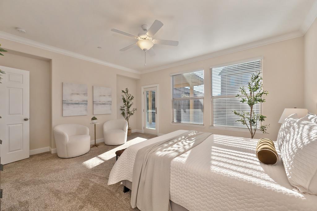 1964 Hartsfield Way Lincoln, CA 95648 - Photo 27 of 37 a bedroom with a bed and a chandelier