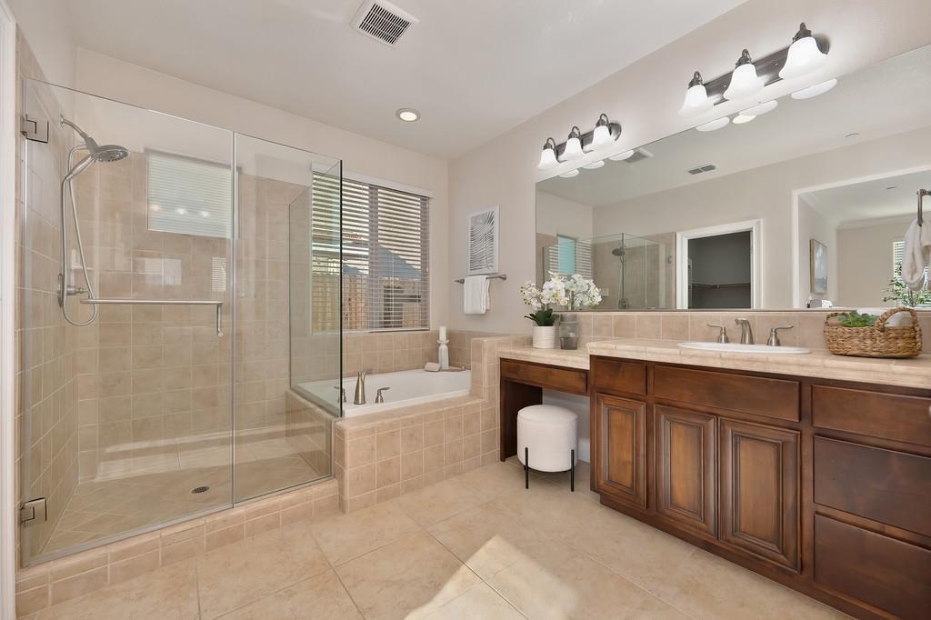 1964 Hartsfield Way Lincoln, CA 95648 - Photo 29 of 37 a spacious bathroom with a tub sink a mirror and a shower