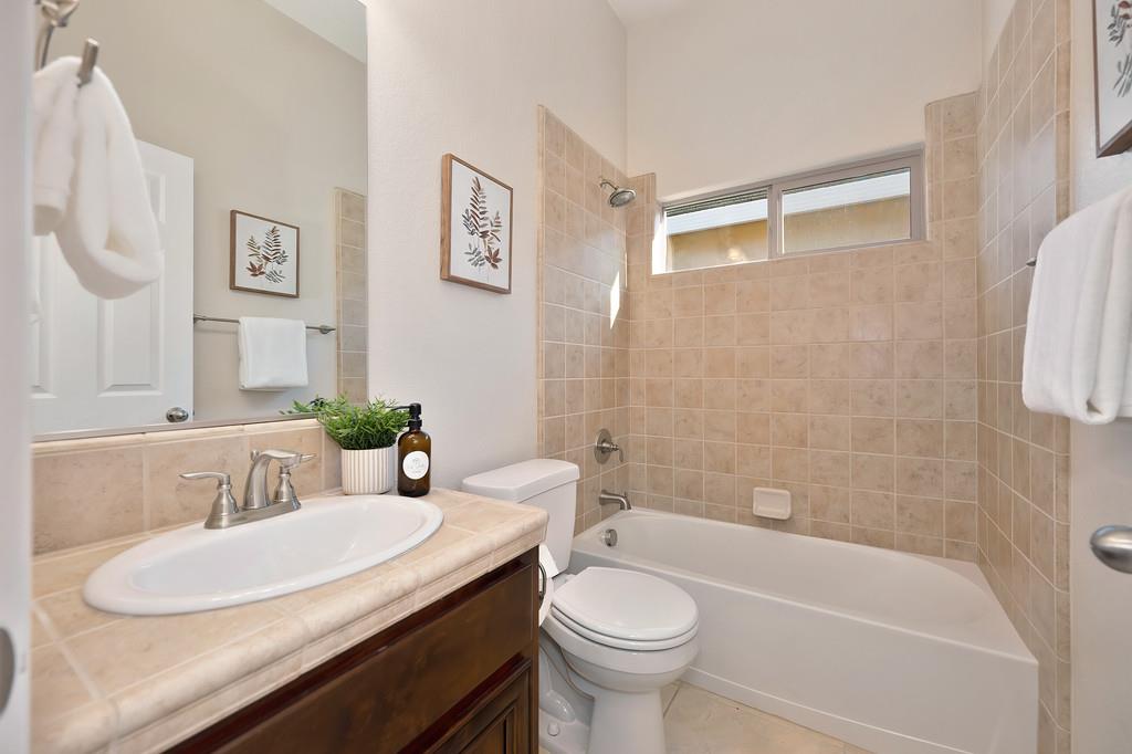 1964 Hartsfield Way Lincoln, CA 95648 - Photo 10 of 37 a bathroom with a granite countertop sink and a mirror