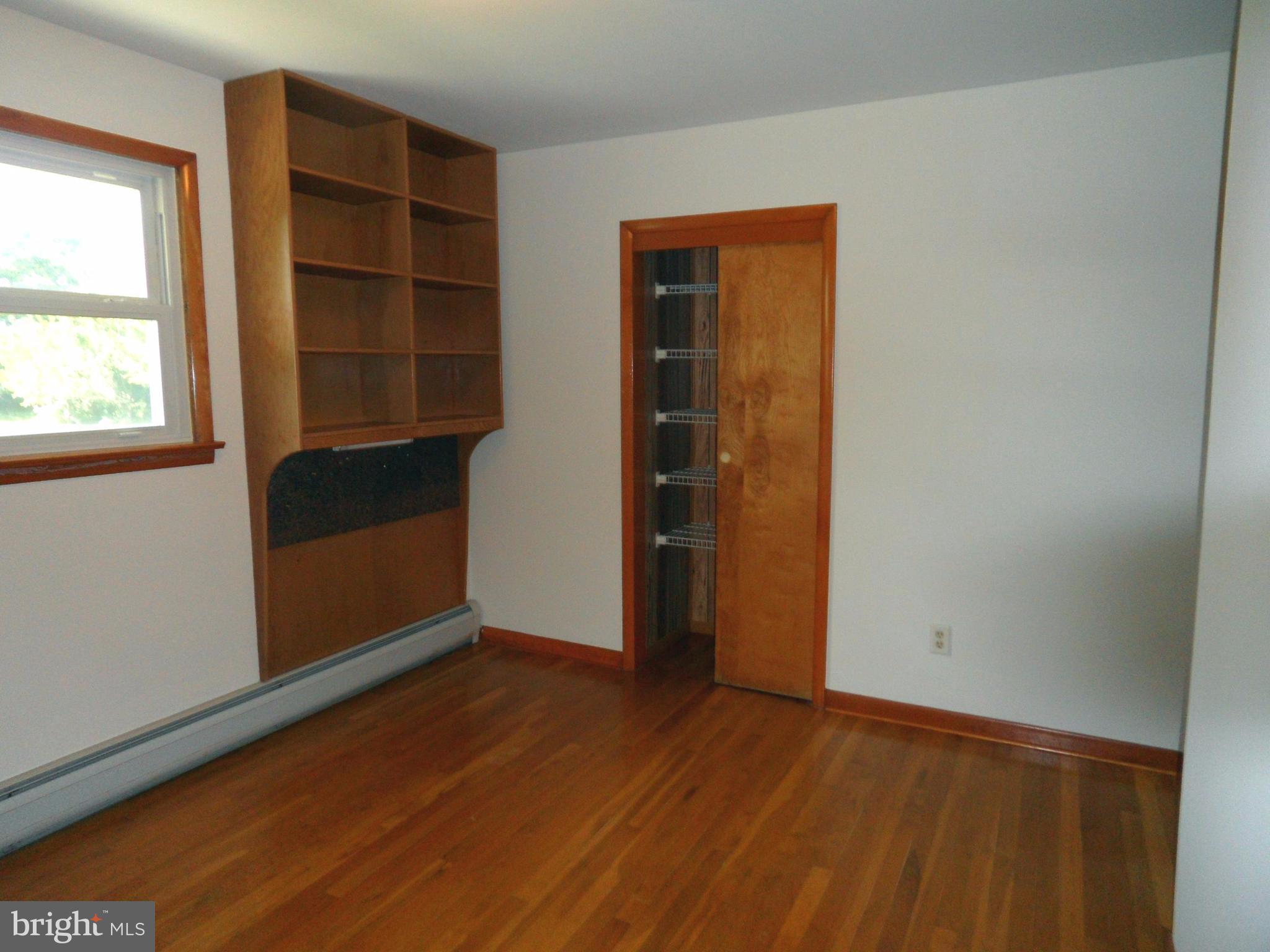 5976 Grove Hill Road Frederick, MD 21703 - Photo 12 of 15 Bedroom with custom shelving