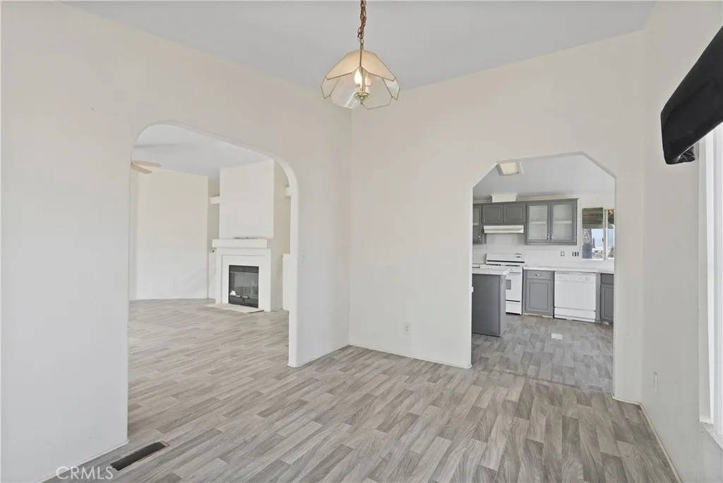 22540 Markham Street Perris, CA 92570 - Photo 11 of 20 a view of a kitchen cabinets and wooden floor