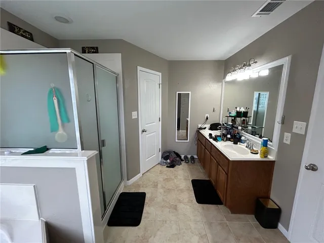 a room with a sink a washer and dryer