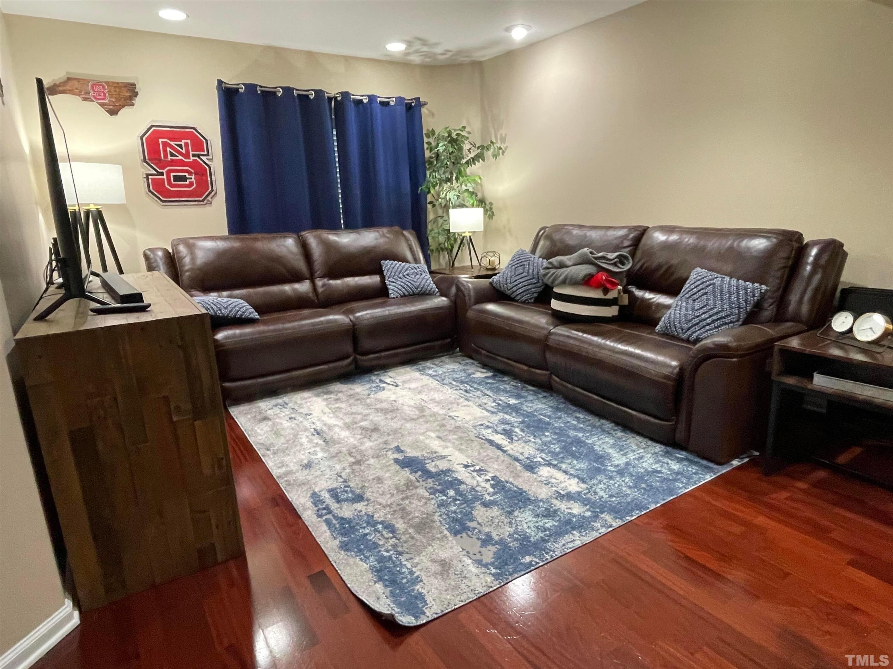 720 Bilyeu Street, Unit 203 Raleigh, NC 27606 - Photo 8 of 13 a living room with furniture