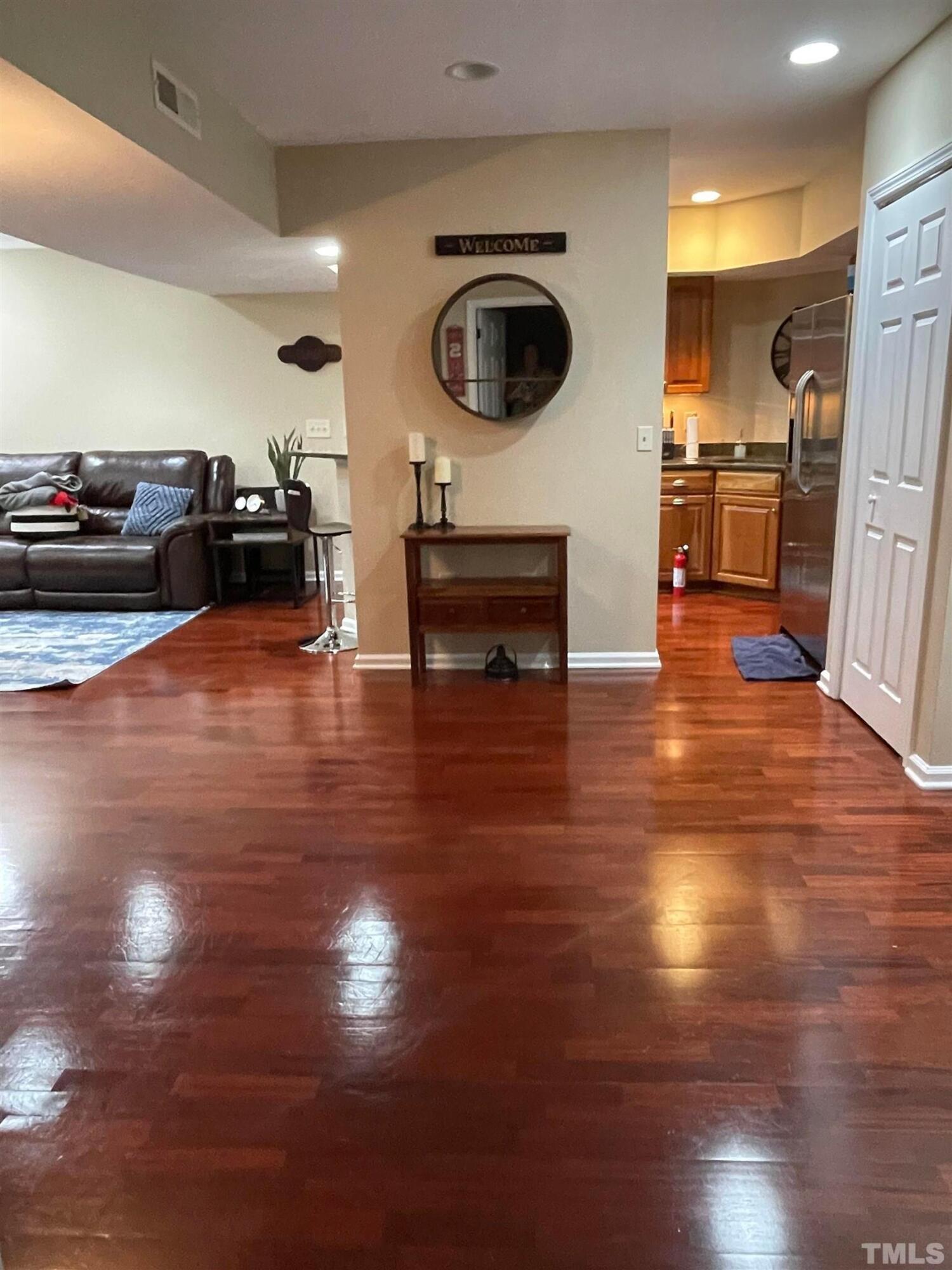 720 Bilyeu Street, Unit 203 Raleigh, NC 27606 - Photo 10 of 13 a kitchen with sink refrigerator and cabinets