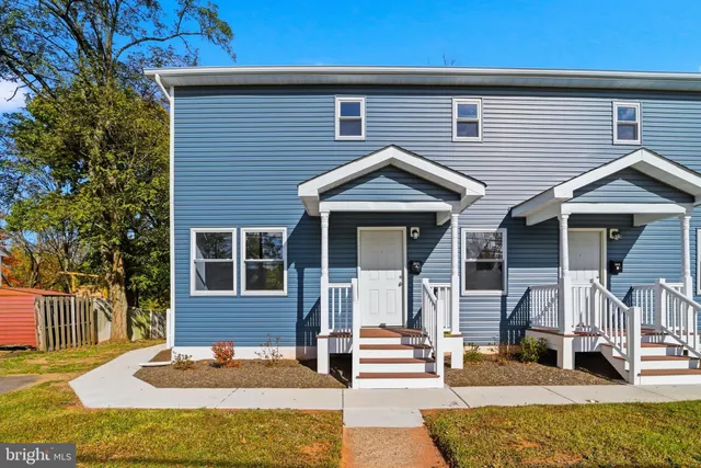 a front view of a house with a porch
