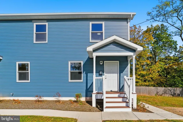 a front view of a house with a garage