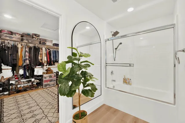 a living room with furniture and a ceiling fan