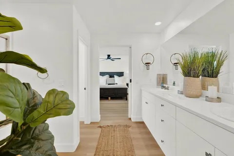 a living room with furniture and a clock