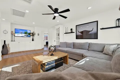 a bathroom with a sink and mirror with toilet