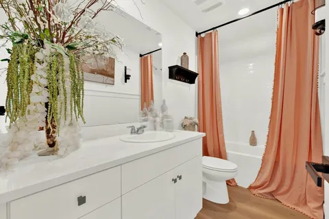 a bedroom with furniture and a window