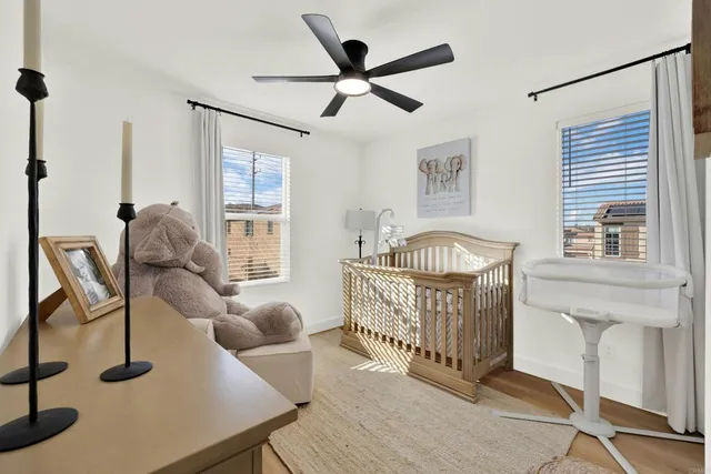 a bed room with a bed and a baby bed