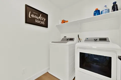 a room with a bed and a dresser