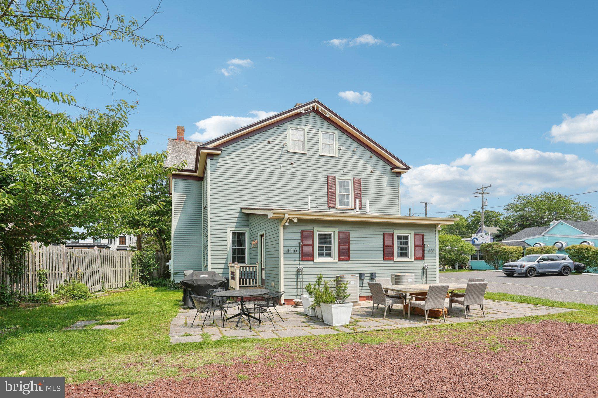 414 Broadway Cape May, NJ 08204 - Photo 15 of 48 a front view of a house with garden