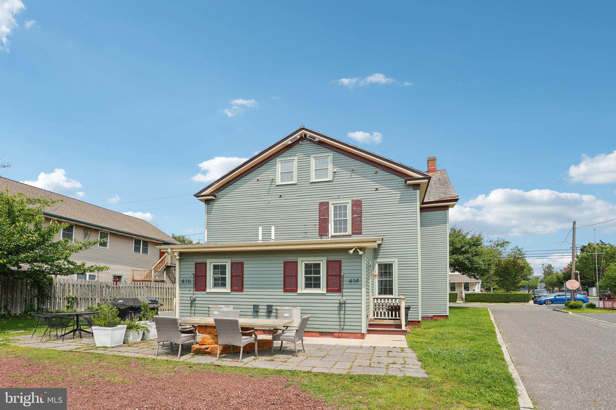 414 Broadway Cape May, NJ 08204 - Photo 17 of 48 a front view of house with yard and green space
