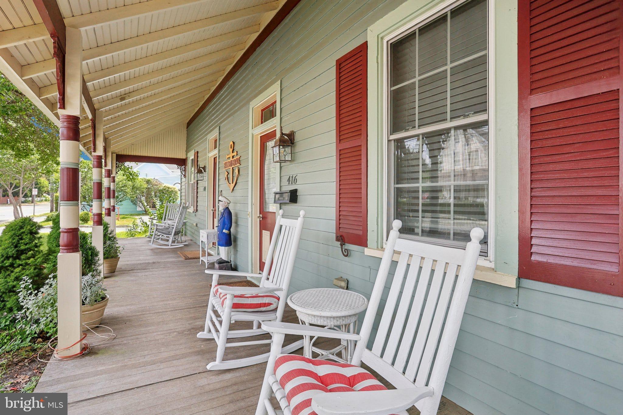 414 Broadway Cape May, NJ 08204 - Photo 23 of 48 a view of a balcony with chairs and wooden floor