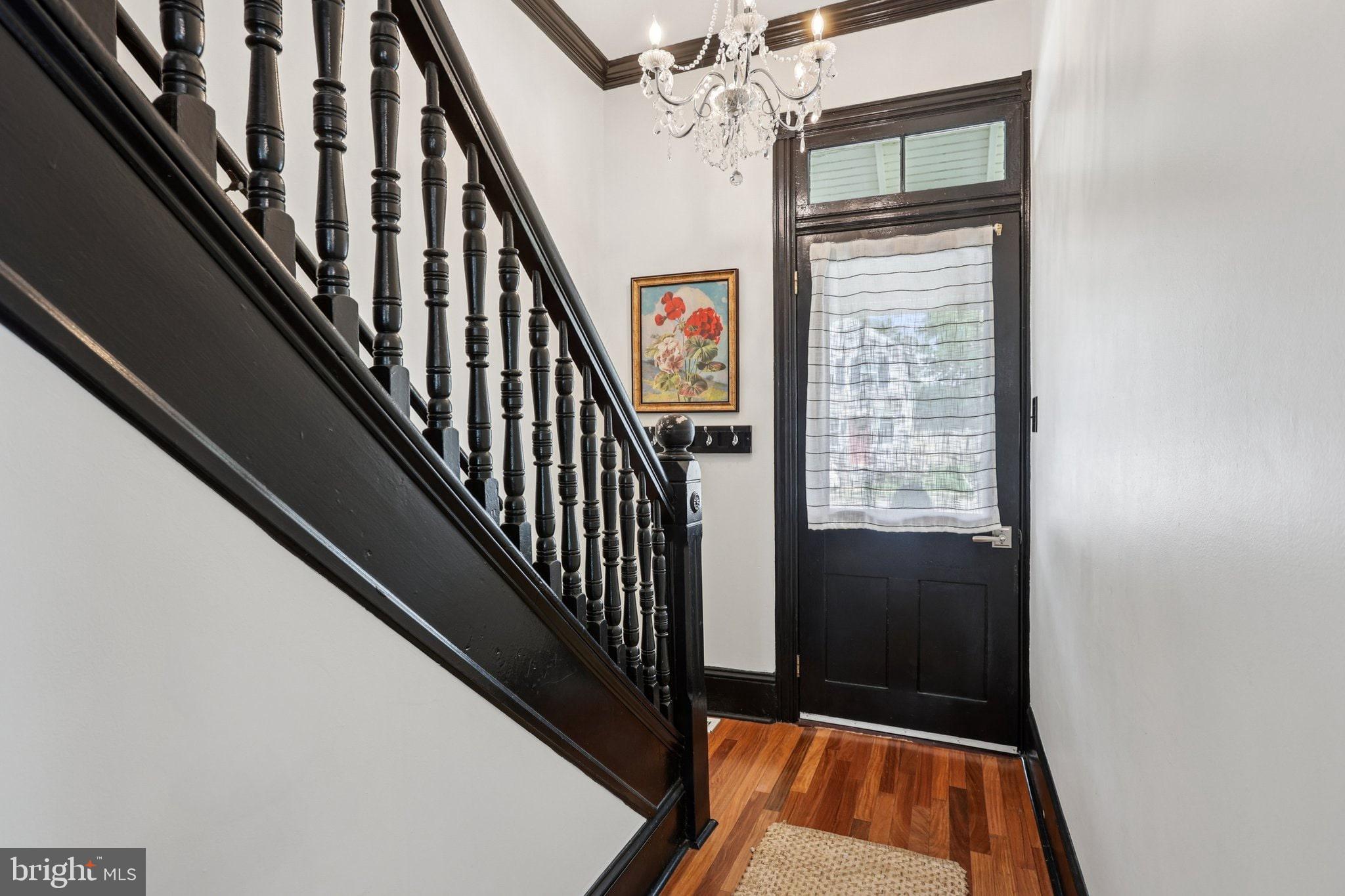 414 Broadway Cape May, NJ 08204 - Photo 25 of 48 a view of staircase with railing and a chandelier