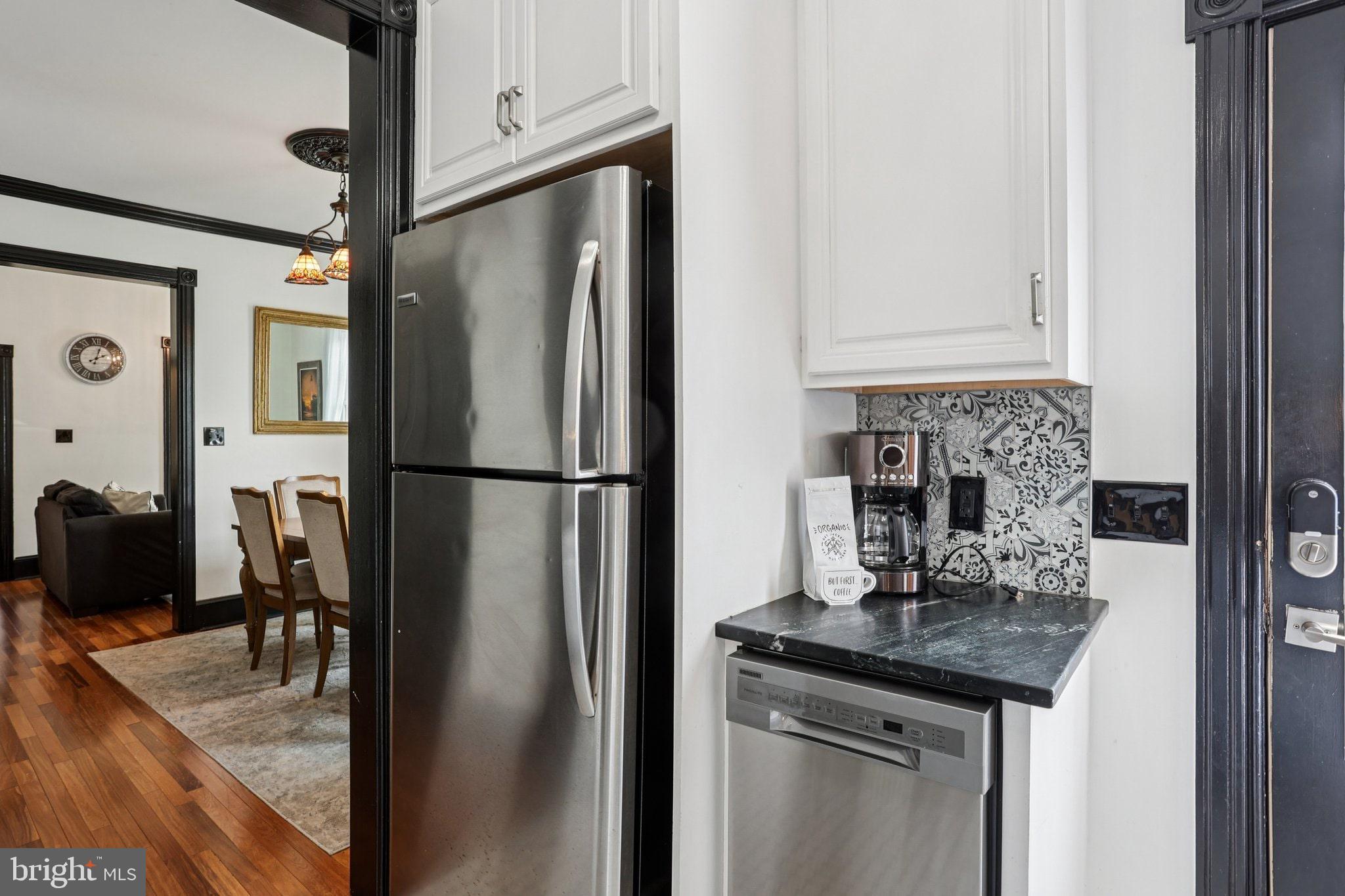 414 Broadway Cape May, NJ 08204 - Photo 36 of 48 a kitchen with stainless steel appliances granite countertop a refrigerator and a sink
