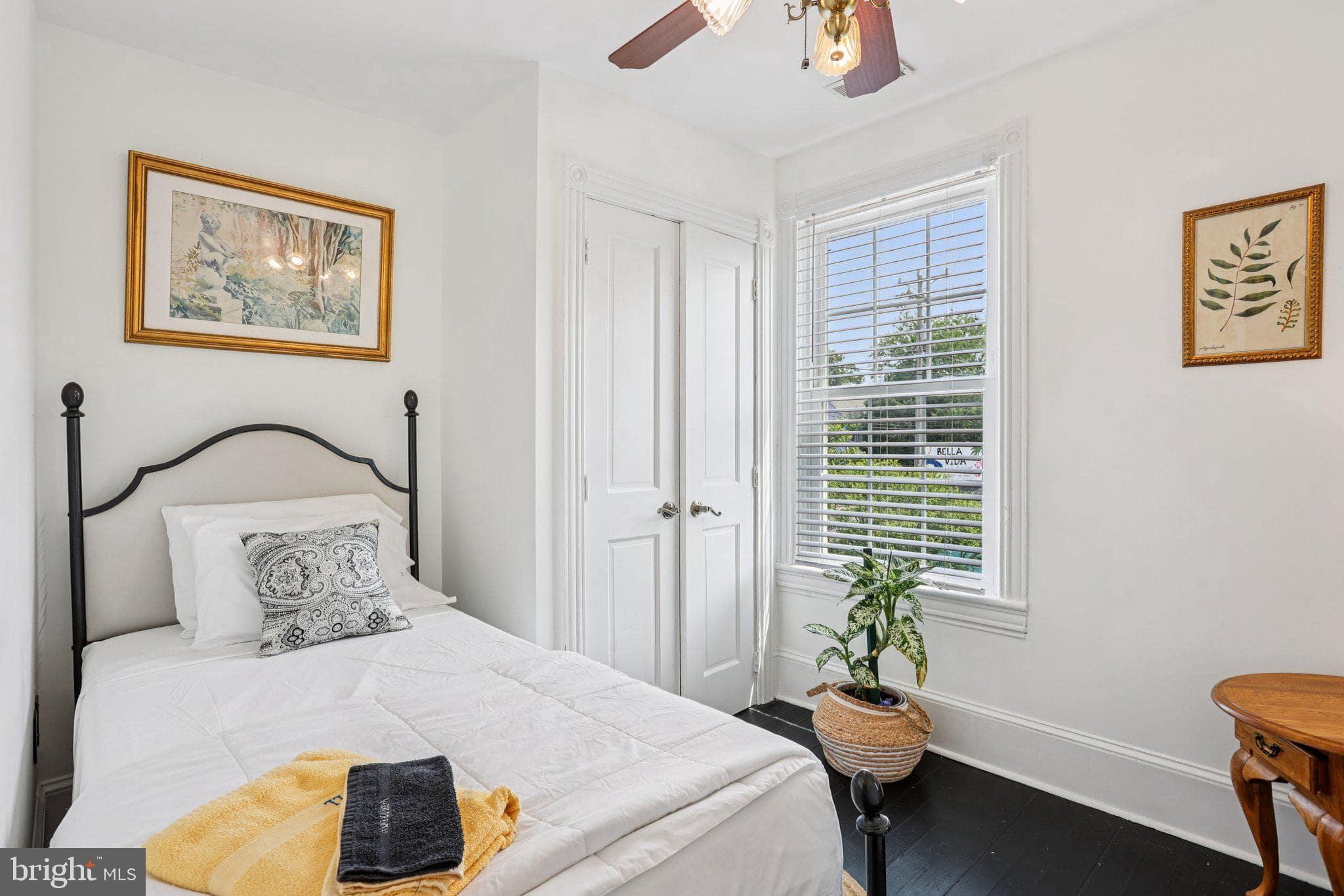 414 Broadway Cape May, NJ 08204 - Photo 47 of 48 a bedroom with a bed and a window