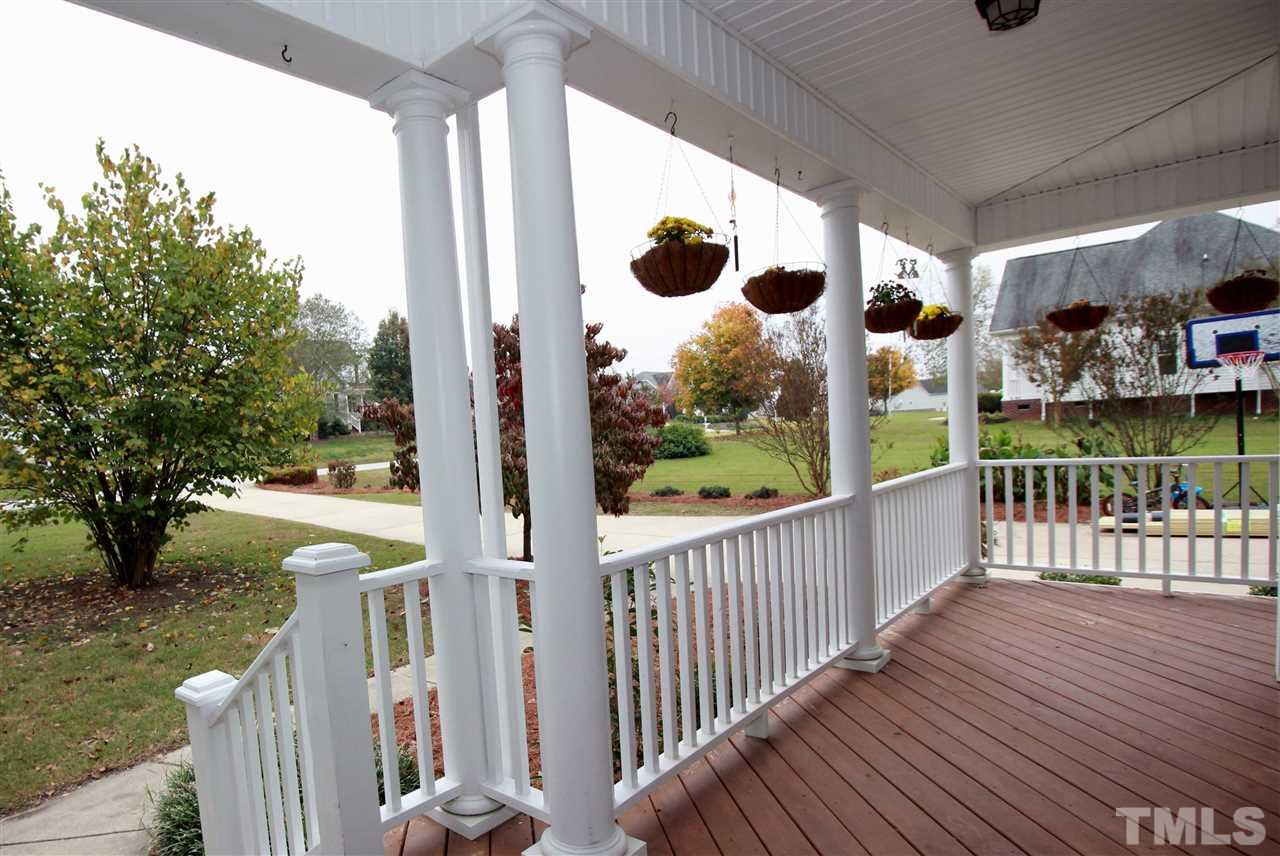 8808 Oregon Inlet Court Raleigh, NC 27603 - Photo 3 of 19 a view of a porch with wooden floor and fence