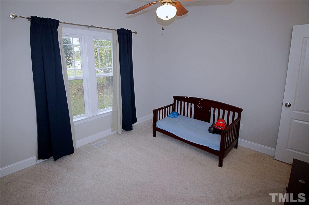 8808 Oregon Inlet Court Raleigh, NC 27603 - Photo 8 of 19 a view of a hallway with a door and a window
