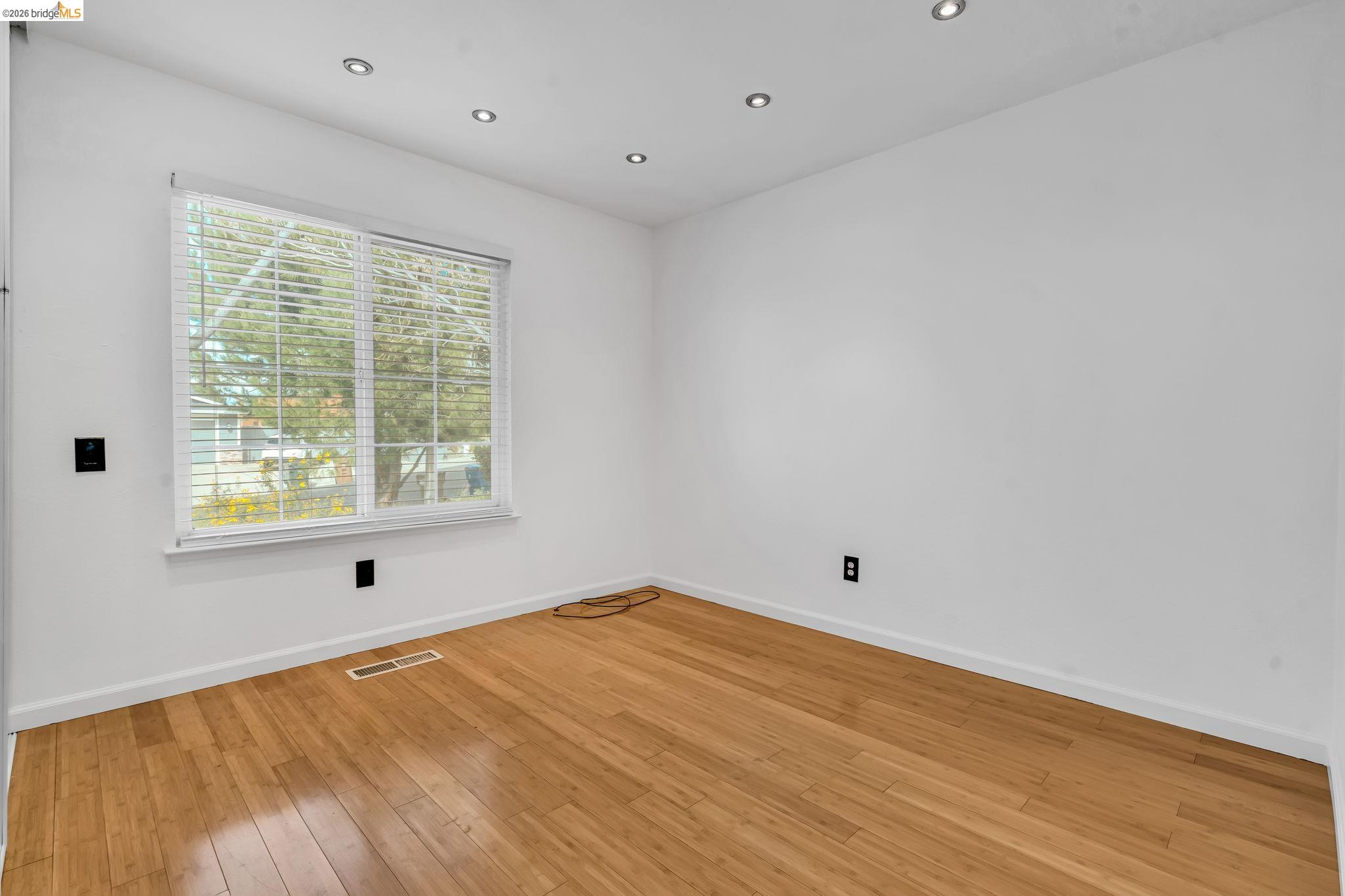 909 Halite Way Antioch, CA 94509 - Photo 11 of 52 a view of empty room with wooden floor and fan