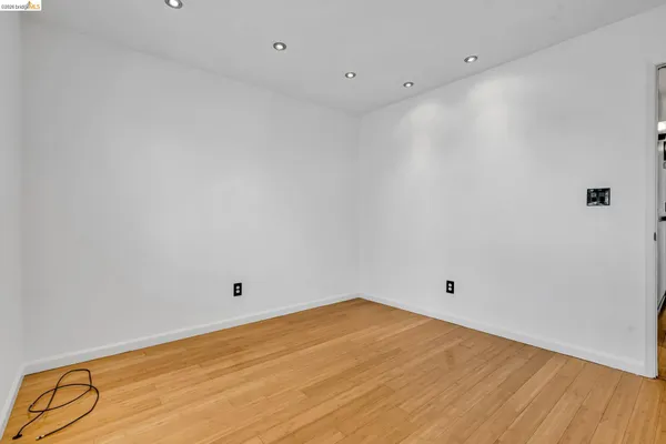 a bathroom with a granite countertop sink toilet a mirror and shower