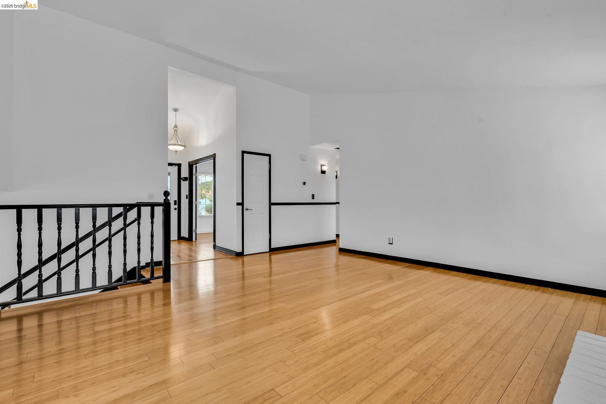 909 Halite Way Antioch, CA 94509 - Photo 22 of 52 an empty room with wooden floor and windows