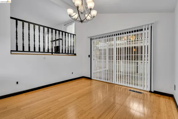 a view of kitchen with cabinets and wooden floor