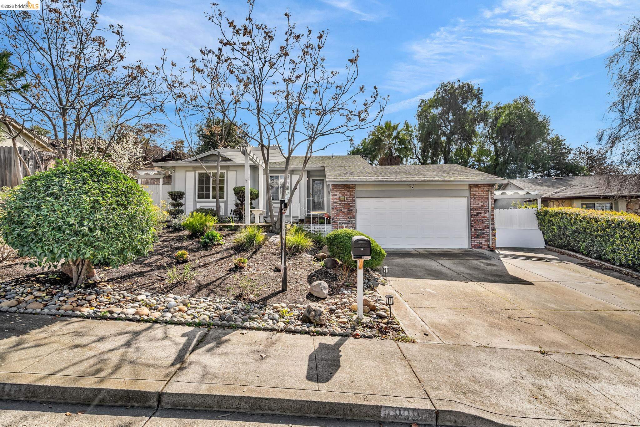 909 Halite Way Antioch, CA 94509 - Photo 3 of 52 a front view of a house with garden