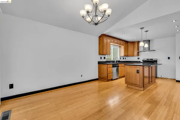 a view of a backyard with wooden fence