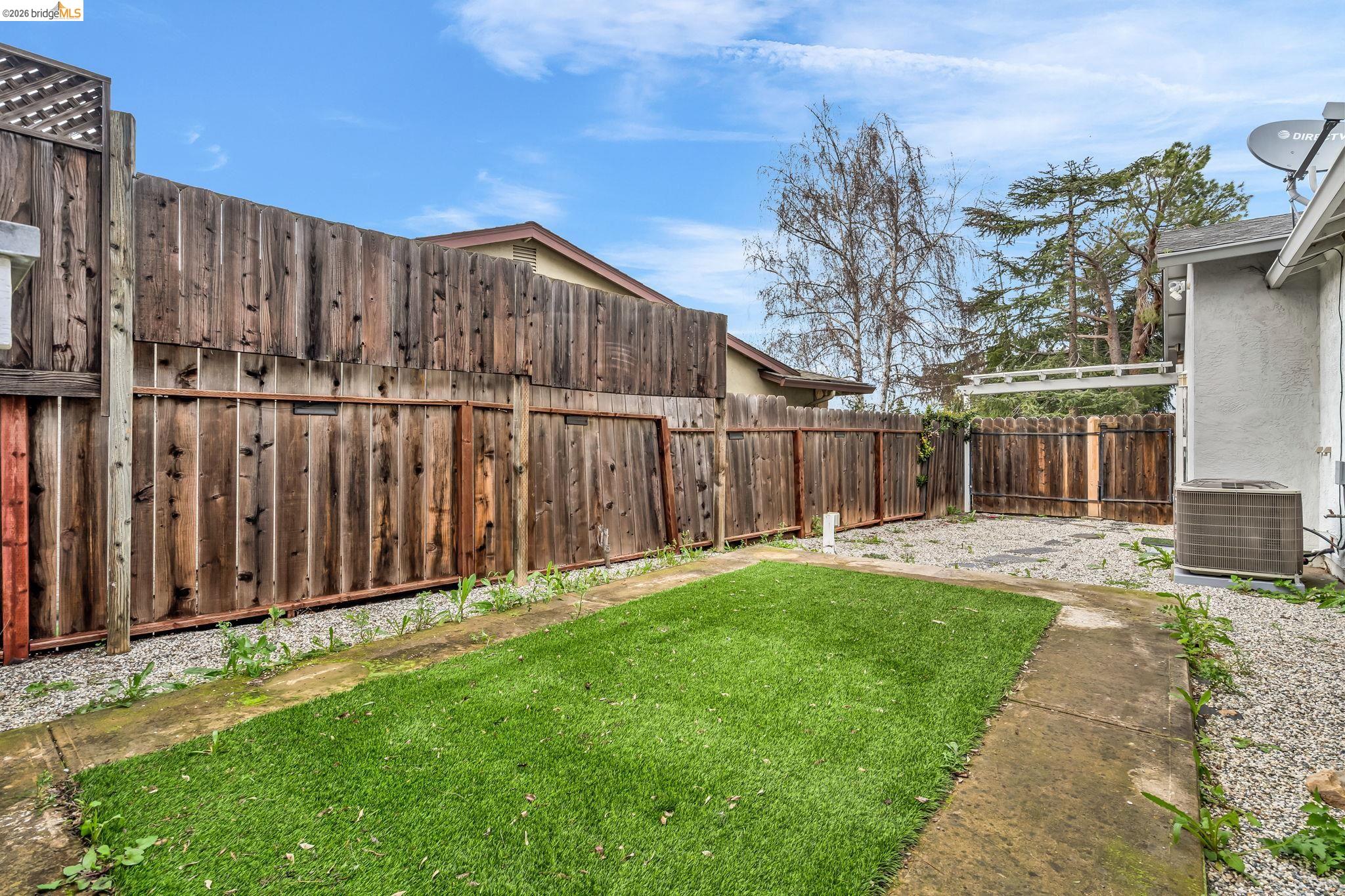 909 Halite Way Antioch, CA 94509 - Photo 33 of 52 a view of a backyard with wooden fence