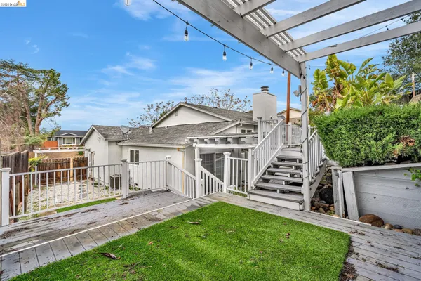 a view of a wooden deck with a bench