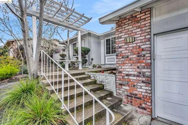 a front view of a house with garden