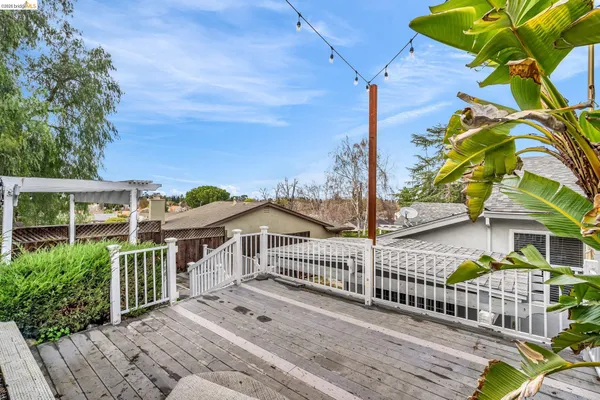a view of a chairs with a flower in a yard