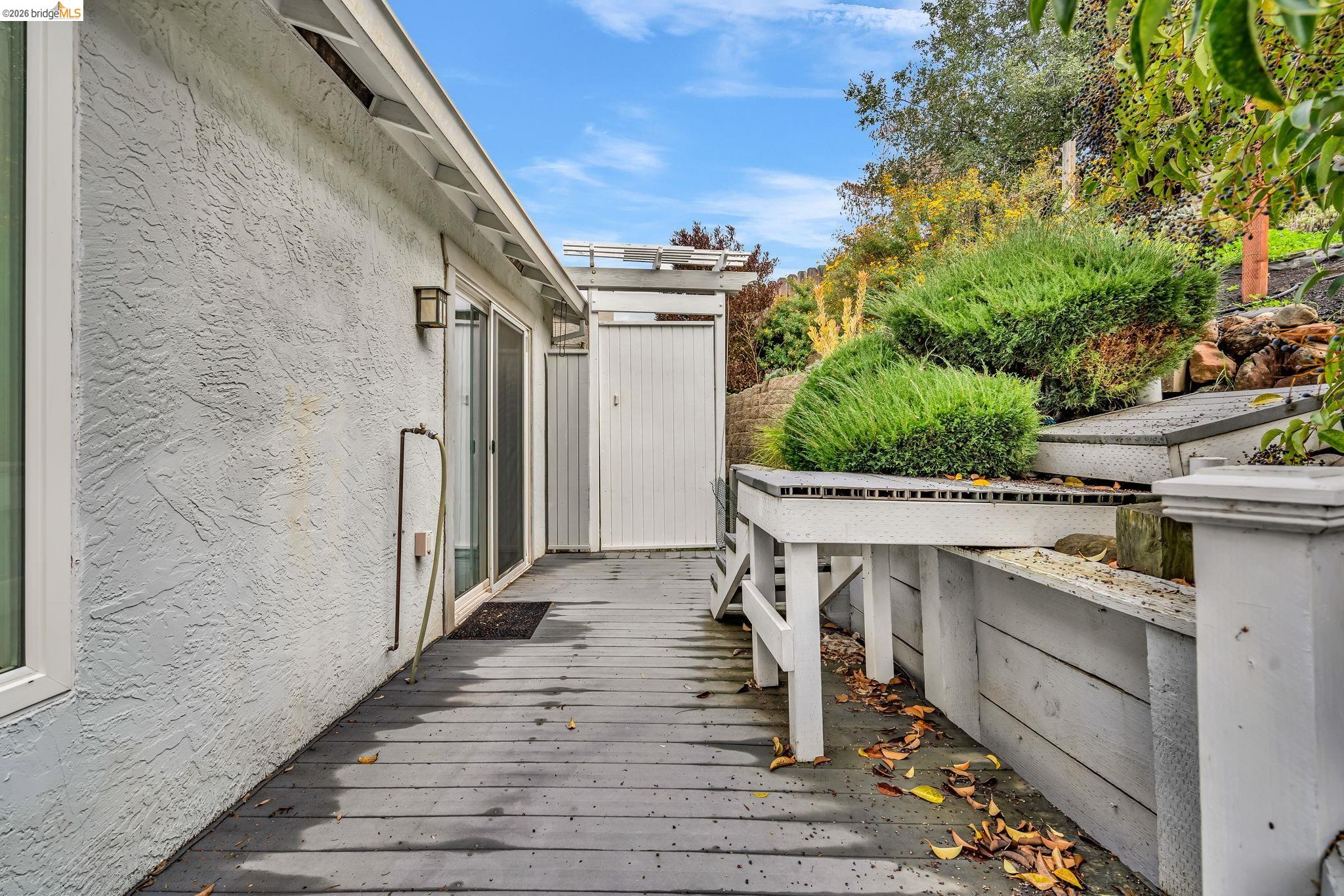 909 Halite Way Antioch, CA 94509 - Photo 49 of 52 a view of a patio with table and chairs with wooden floor and fence