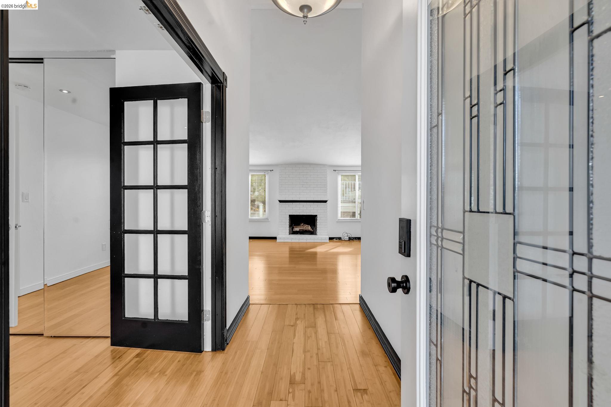 909 Halite Way Antioch, CA 94509 - Photo 7 of 52 a view of a hallway with wooden floor and staircase