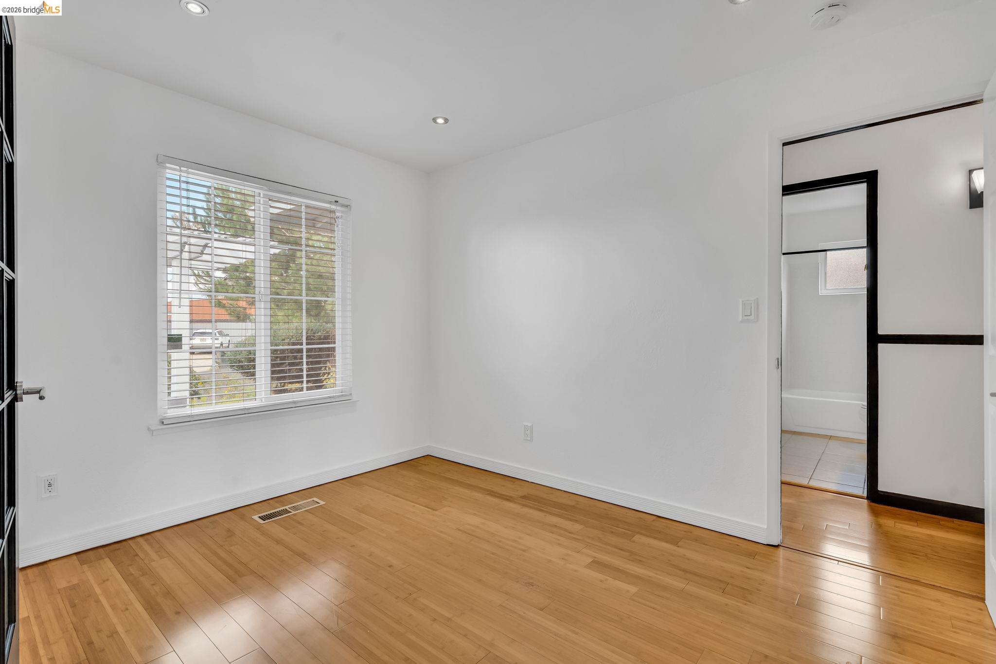 909 Halite Way Antioch, CA 94509 - Photo 8 of 52 a view of empty room with wooden floor and fan