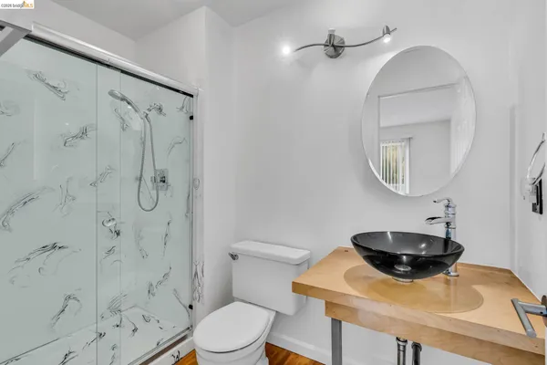 a view of an empty room with a fireplace and a window