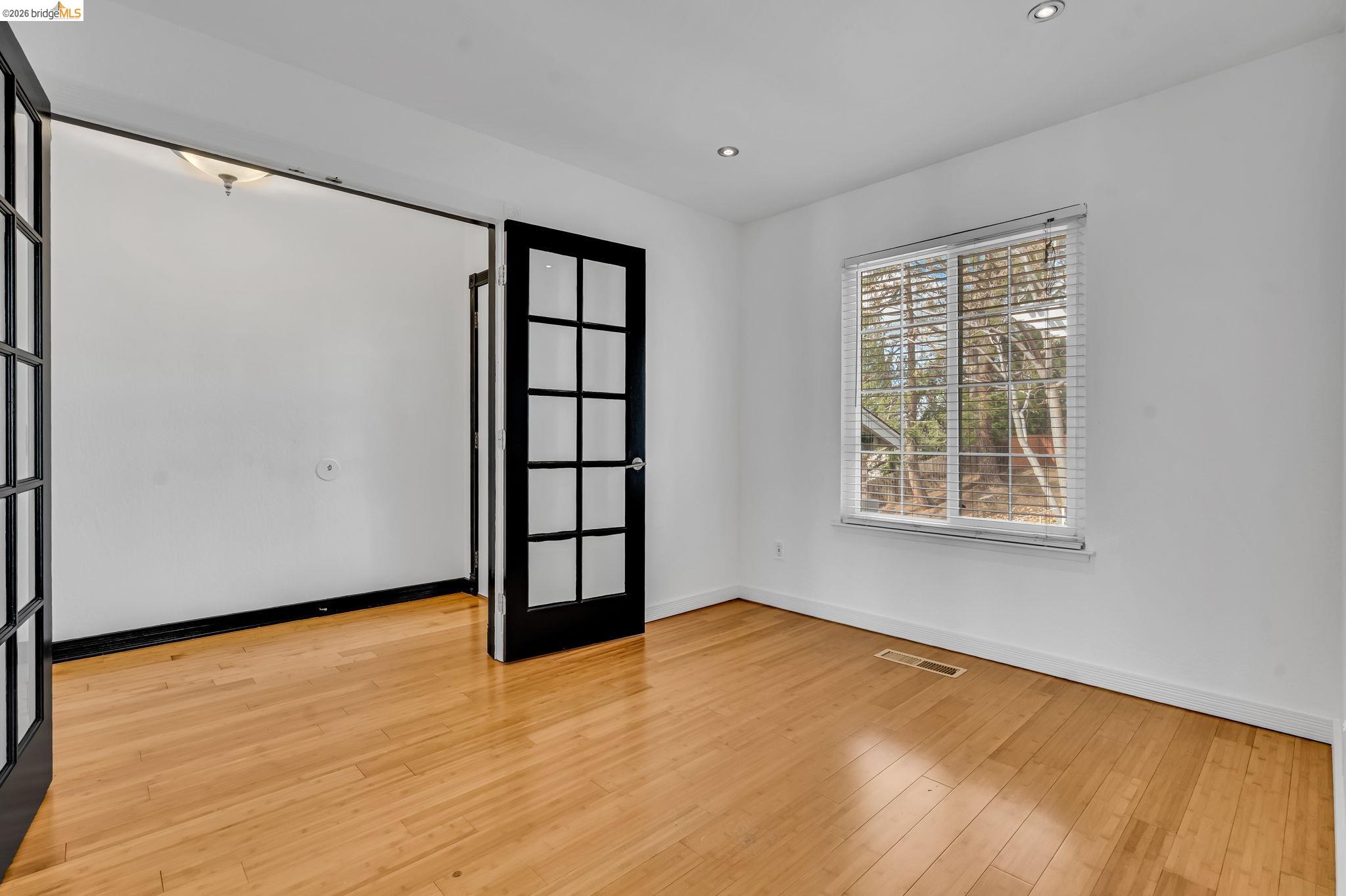 909 Halite Way Antioch, CA 94509 - Photo 10 of 52 a view of an empty room with window and wooden floor