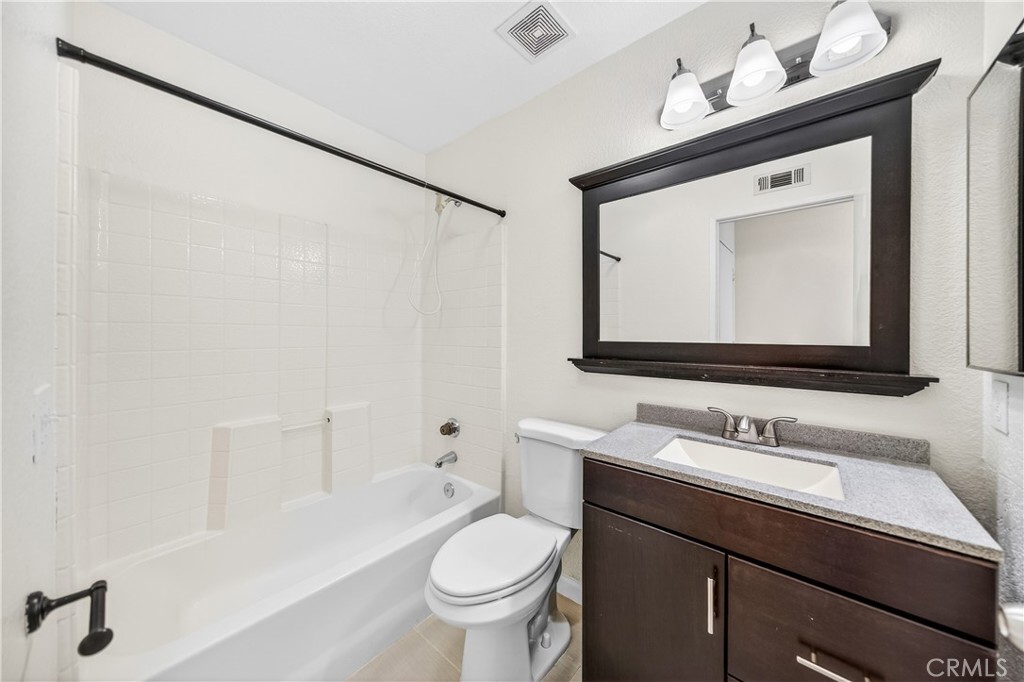 43425 Corte Logrono Temecula, CA 92592 - Photo 18 of 49 a bathroom with a sink vanity mirror and toilet
