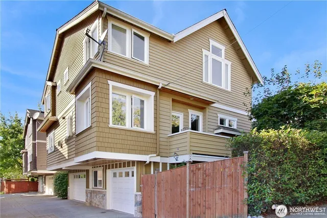 a view of a house with a house and a yard