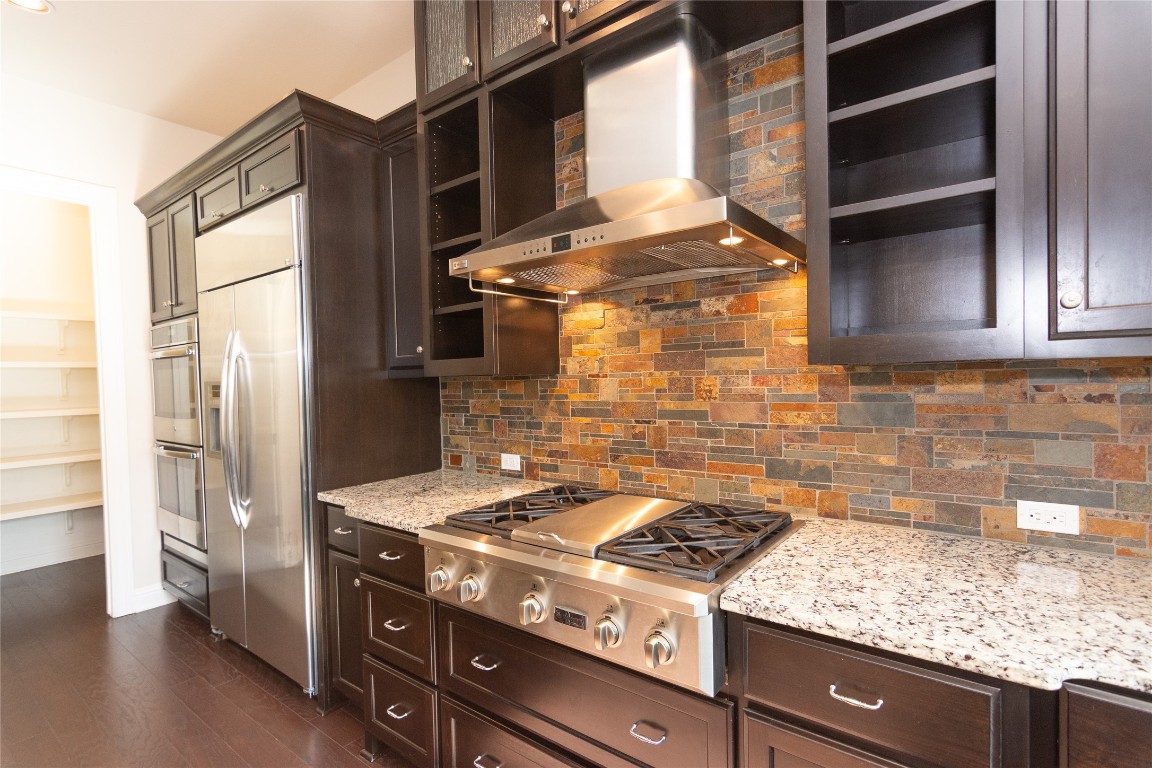 316 Chadwick Drive Georgetown, TX 78628 - Photo 12 of 39 a stove top oven sitting inside of a kitchen