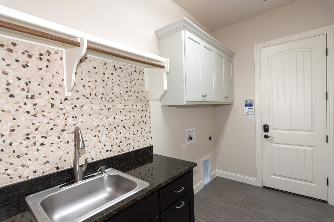 316 Chadwick Drive Georgetown, TX 78628 - Photo 16 of 39 a kitchen with granite countertop a sink and a granite counter tops