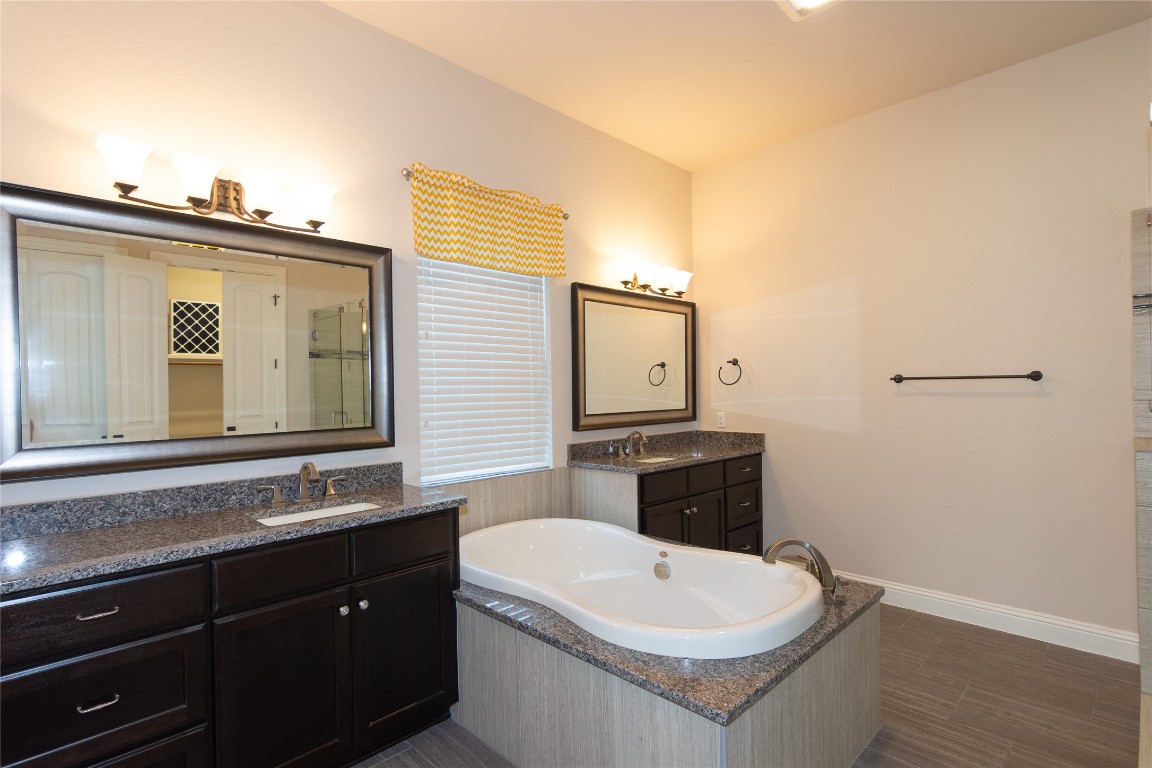 316 Chadwick Drive Georgetown, TX 78628 - Photo 18 of 39 a bathroom with a sink a toilet and mirror